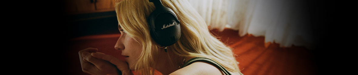 Lady wearing Marshall headphones